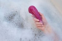 Prikladací vibrátor Womanizer Vibe Sage