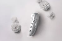 Stimulátor klitorisu Womanizer Pro růžový