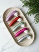 Stimulátor klitorisu Womanizer Pro růžový