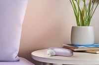 Stimulátor klitorisu Womanizer Pro fialový